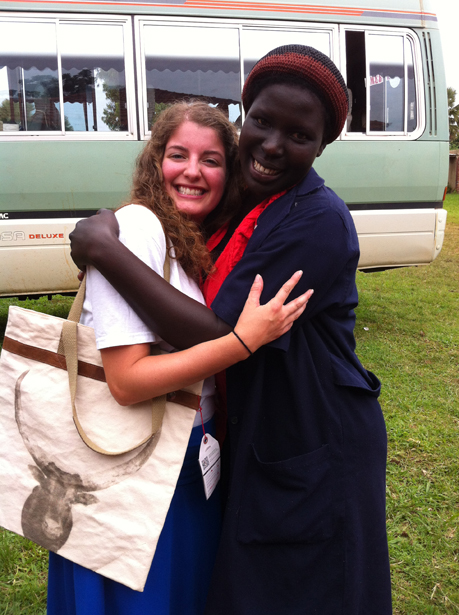 Forrest poses with the seamstress at Mend who made her bag.