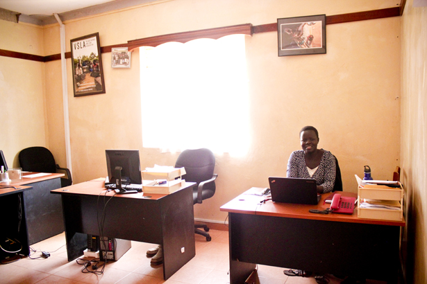 Livelihood Program Officer Bere Aneno Lucy holds down the fort while the rest of her staff is in the field.