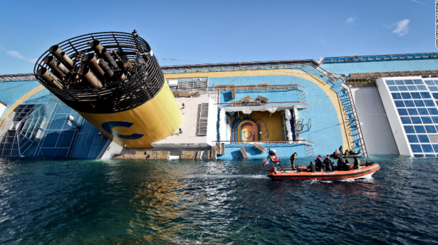 The cruise ship Costa Concordia lies stricken off the shore of the Italian island of Giglio. The ship struck a rock and turned on its side on January 13, killing 32 people from eight countries.