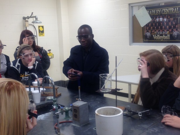 Working with students in the chemistry lab
