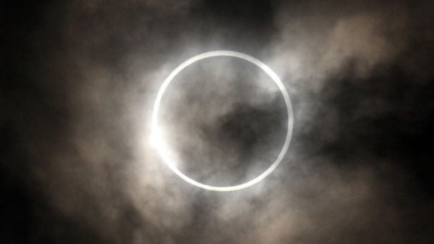 The sun is obscured by the moon during an annular solar eclipse in Tokyo.