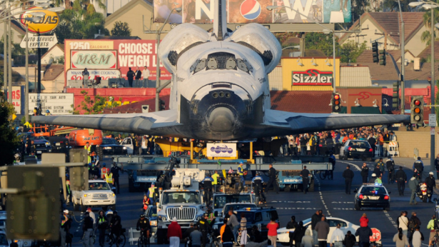 Shuttle Endeavour is transported to The Forum arena for a stopover and celebration in Inglewood, California. The space shuttle was on 12-mile journey from the Los Angeles International Airport to the California Science Center to go on permanent public display.