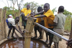 children at the water pump