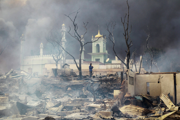 A mosque burns amid riots in Meikhtila.