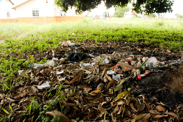 One of the non-designated areas where trash has piled up. The students and staff of Sir Samuel Baker school have come up with a plan to keep all trash to designated areas.