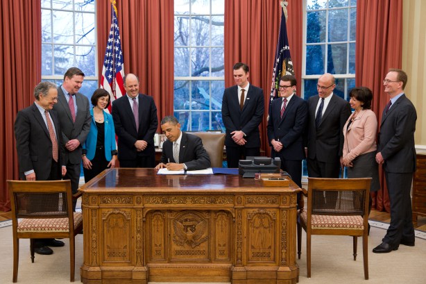 President Obama signing the Rewards for Justice bill on Jan 15, 2013