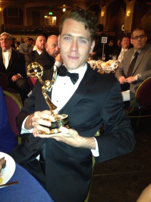 Here's Cameron casually hanging out at the Emmy awards show, holding the Emmy he casually won.