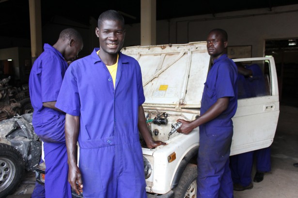 Kenneth and his classmates get hands on experience repairing cars and trucks.
