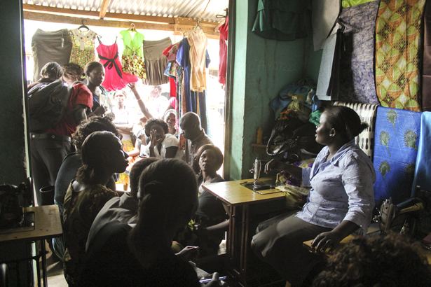 Local tailors at the public market explain what the work is like, sharing advice and challenges. Ajok Betty was encouraged by the visit: “From this IGA, this lady is able to pay her children in school. I want to get a machine for making tablecloths that I can sell on the weekends.”