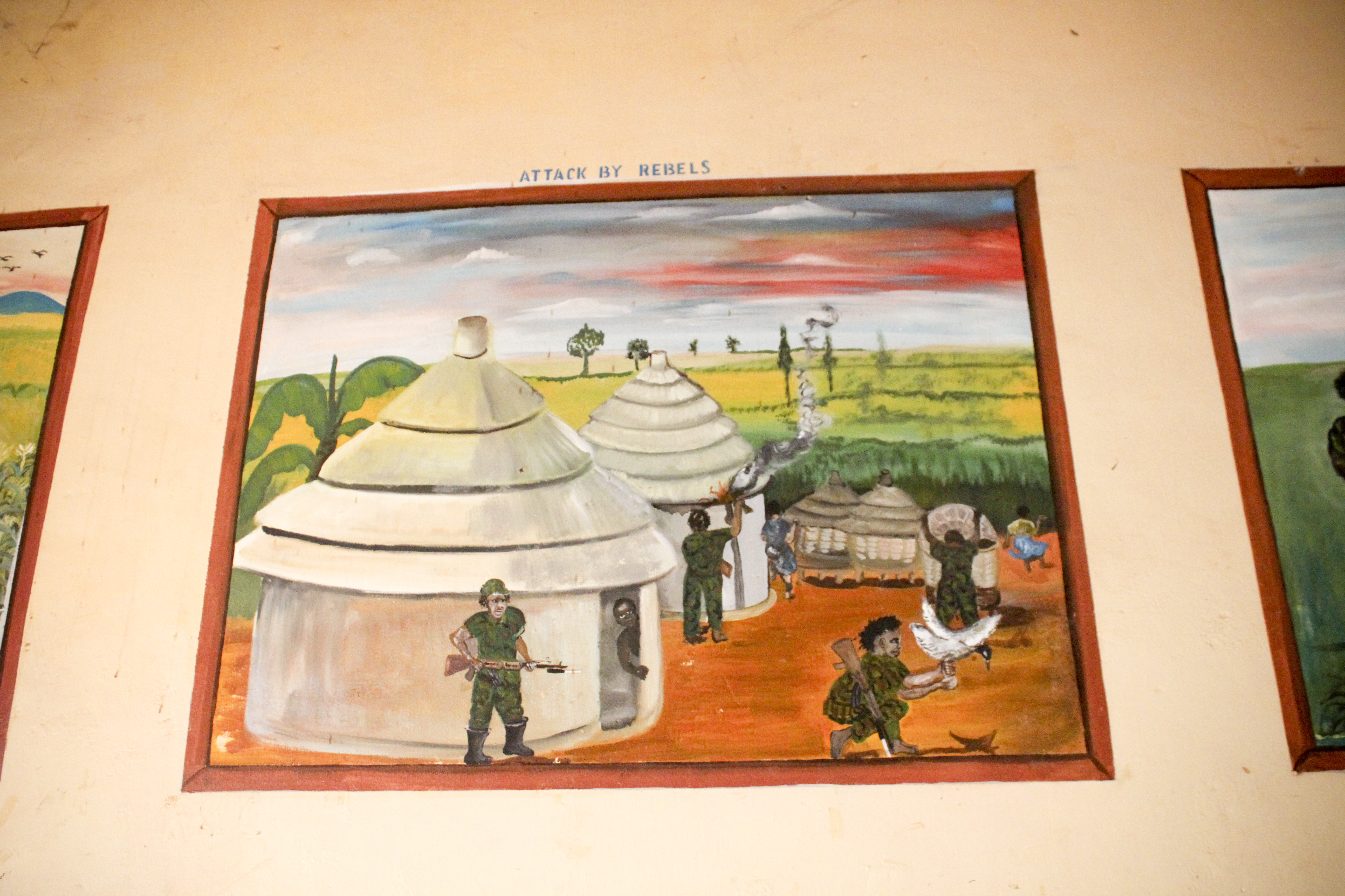 Paintings on the wall of the rehabilitation center depicting the experiences of abducted children.