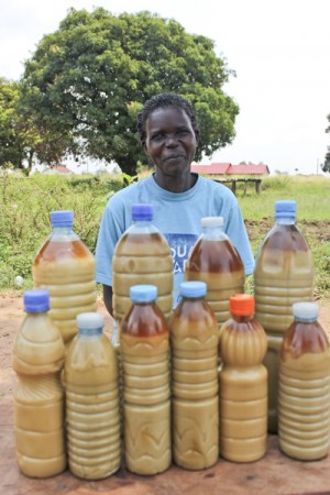 Milly sells the oil she made at the roadside market.