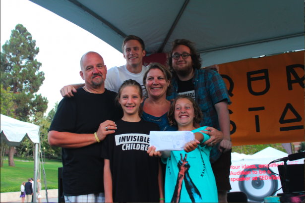 Sofia (blue shirt) with her family and two members of our Communication Dept