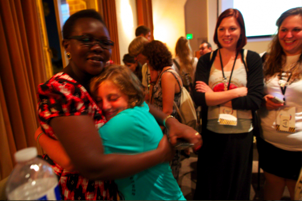 Sofia hugging Jolly Grace Okot Adruvile, Invisible Children's regional ambassador to East and central Africa, after handing over her donation