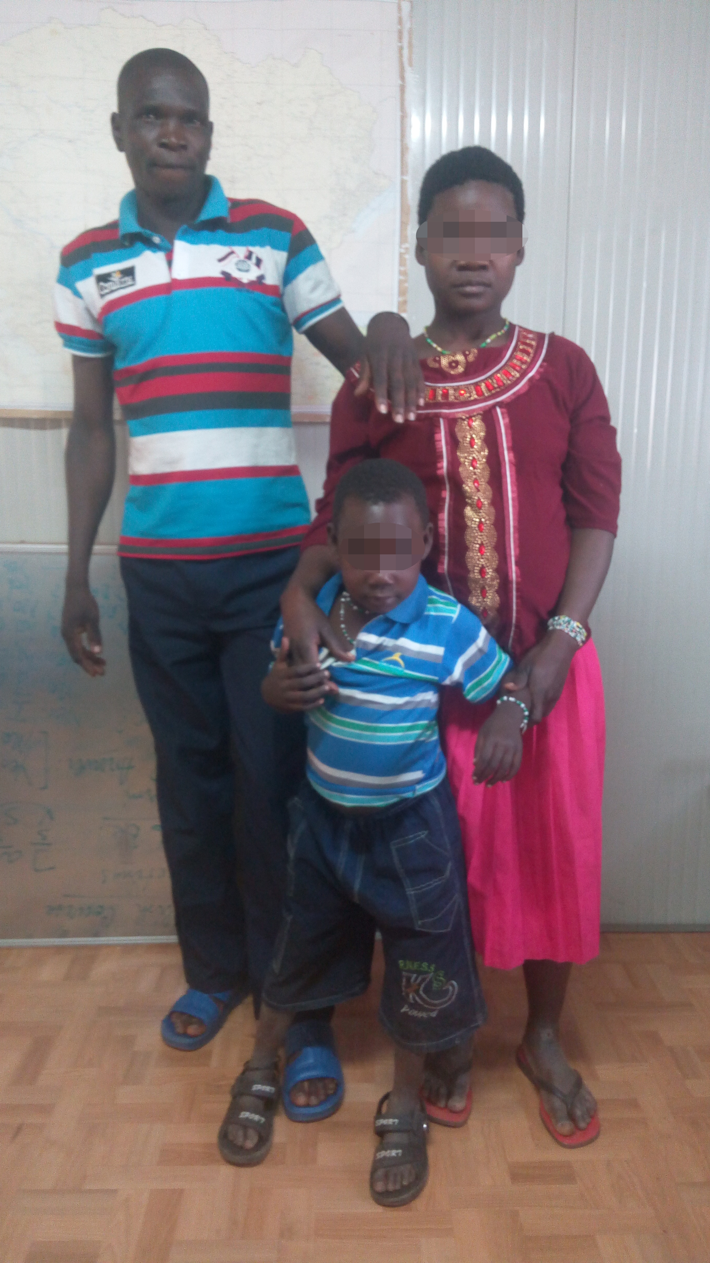 Bosco with the woman and child he escaped LRA captivity with.